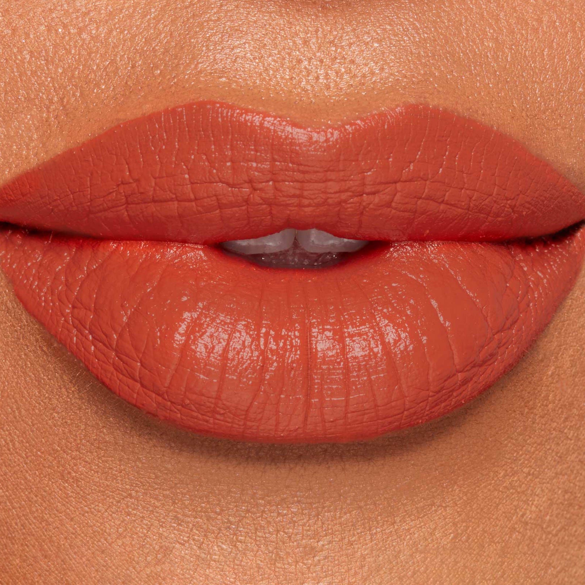 Lunar Beauty Hallows Eve Liquid Lipstick in spicy pumpkin orange medium skin