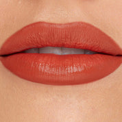 Lunar Beauty Hallows Eve Liquid Lipstick in spicy pumpkin orange fair skin